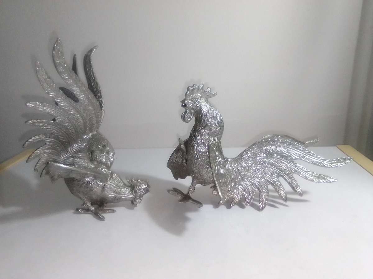 1950's A Vintage pair of fighting roosters. This pair is fierce! Silver plated over cast Brass.