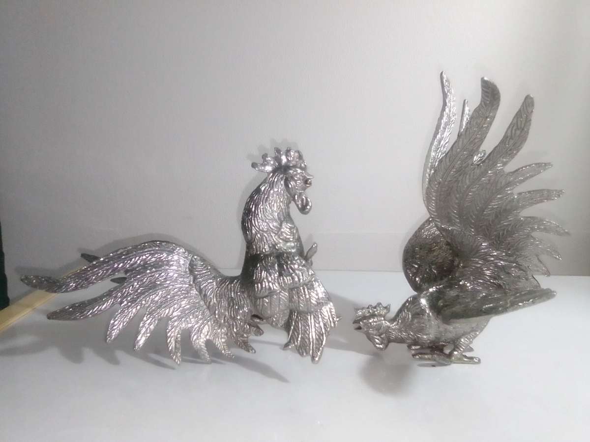 1950's A Vintage pair of fighting roosters. This pair is fierce! Silver plated over cast Brass.