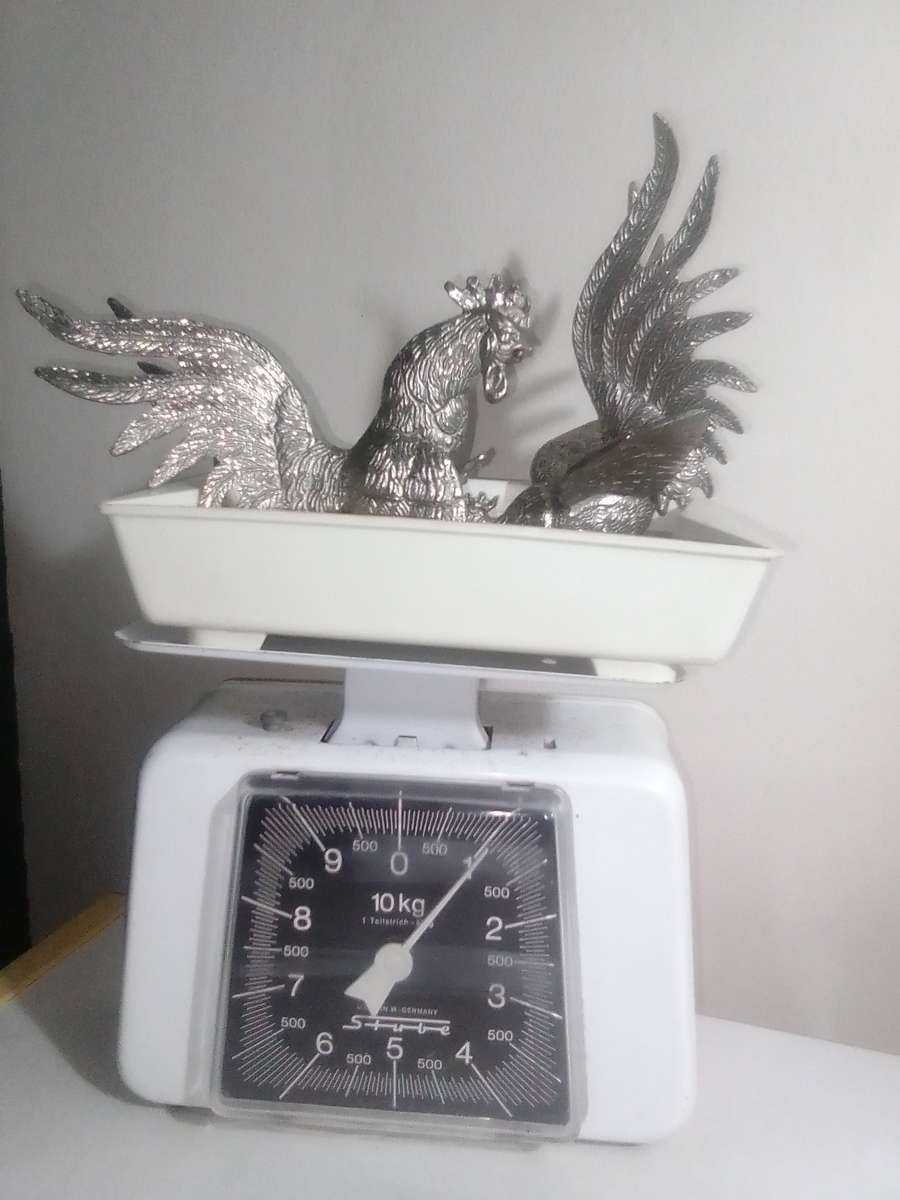 1950's A Vintage pair of fighting roosters. This pair is fierce! Silver plated over cast Brass.