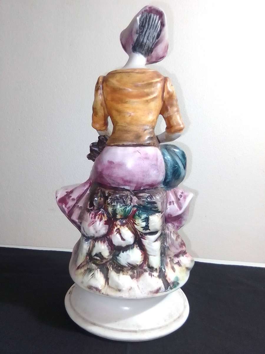 An elegant figurine from master Italian sculptor, A Farm Lady. Capodimonte made in Italy 285mm Tall
