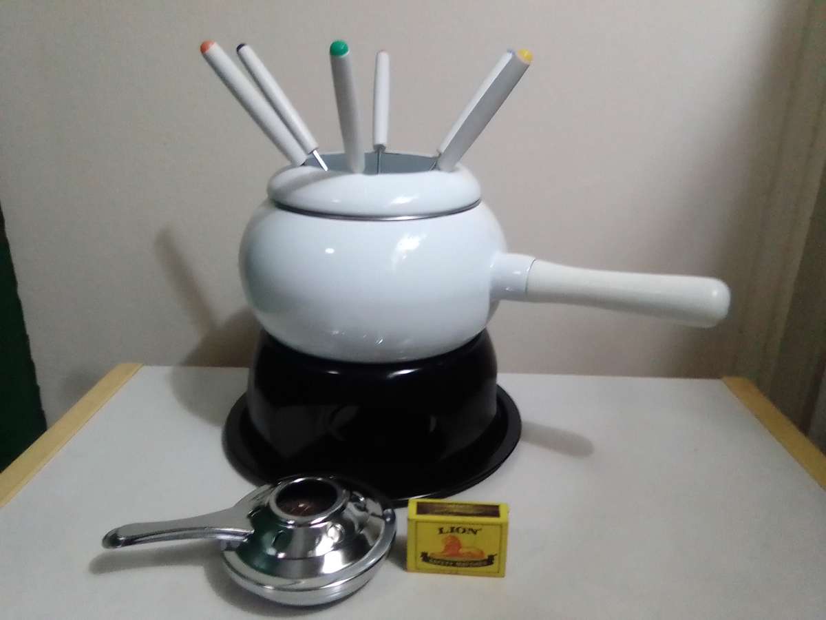 Wow a Elweco boxed complete White enamel Fondue set in almost new condition.
