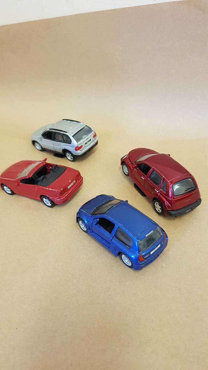 4 Scale model Maisto cars. Renault Clio , Chrysler PT Cruiser ,Mercedes SLK and BMW X5.