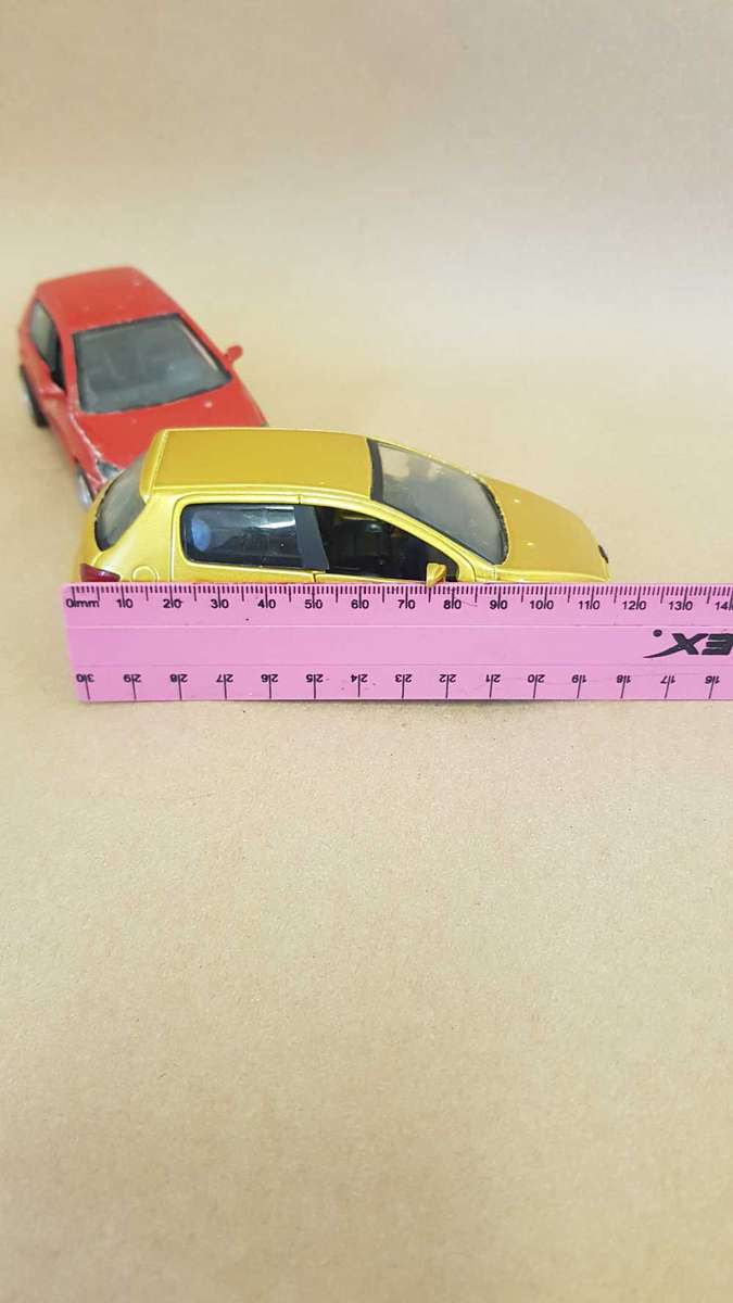 Two Peugeot 307 scale model cars. Dated 2002.