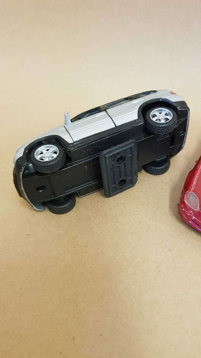 4 Scale model Maisto cars. Renault Clio , Chrysler PT Cruiser ,Mercedes SLK and BMW X5.