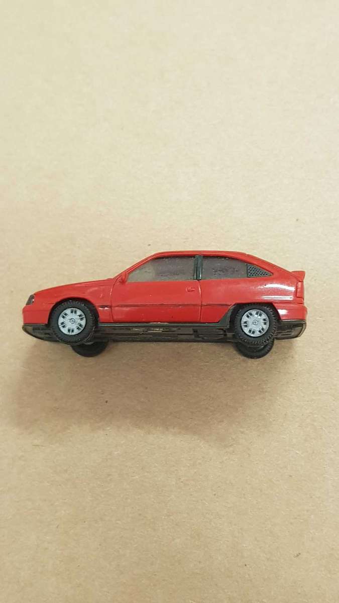 Small model replica of 1986 Opel Kadett Gsi. 45mm as reference.  Made in Germany.  Plastic.