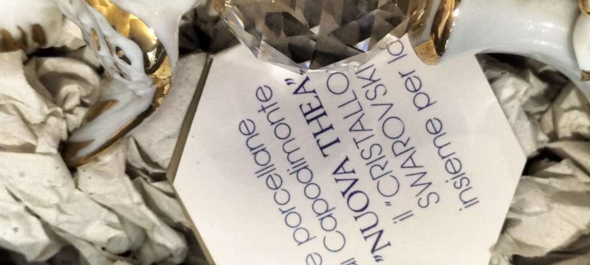 A Magnificent Genuine Swarovski Crystal with Gilded Capodimonte Porcelain Dove