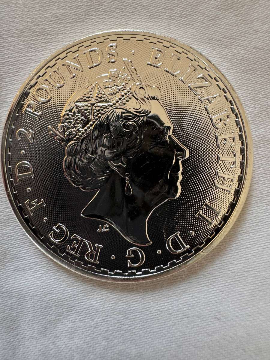 Three UK silver coins and 1 USA silver coin