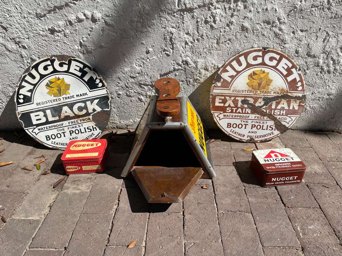 Rare Nugget Shoe Chair plus 2 original Nugget Enamel Signs
