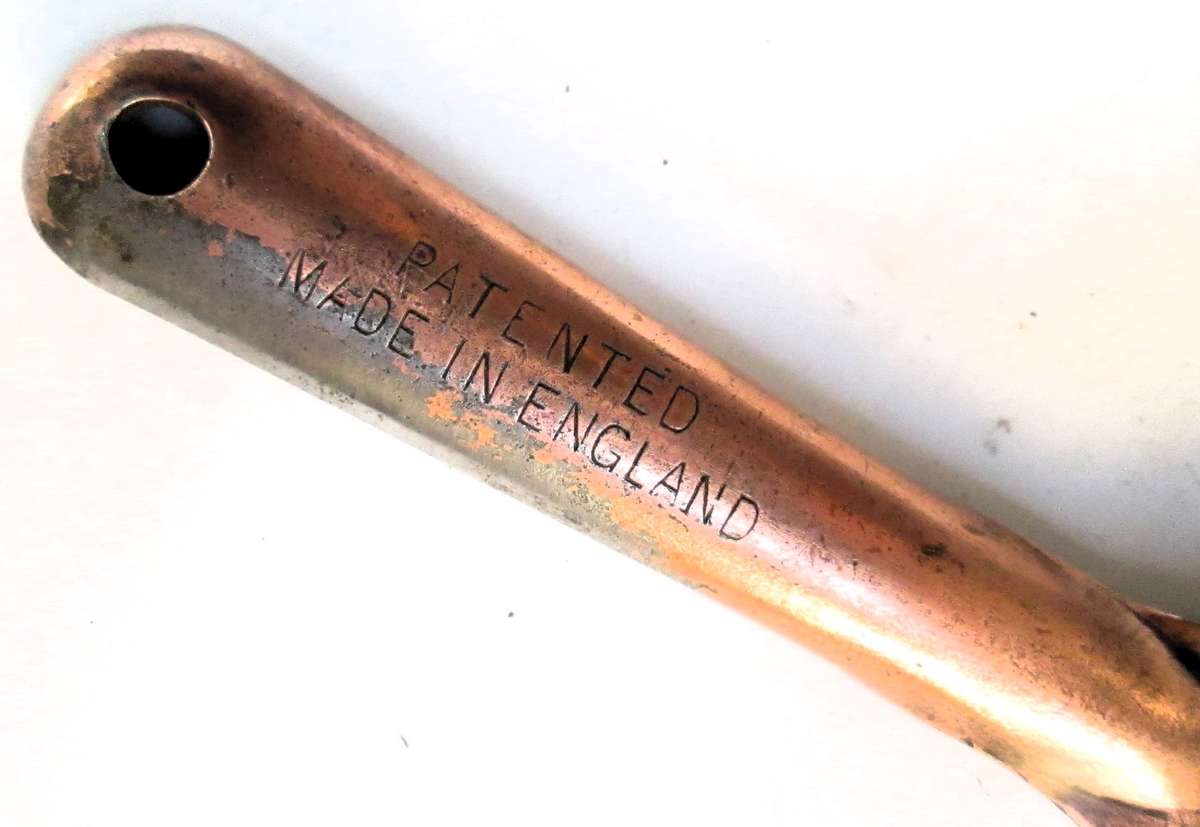 SCRAPER WITH AJUSTABLE HEAD