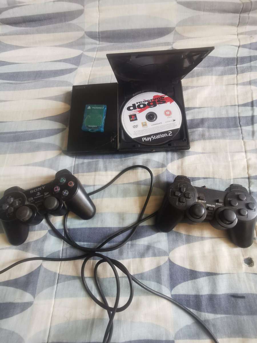 Playstation 2 + 2 remotes and free game (Read listing)