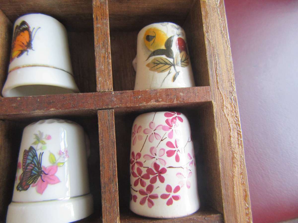 20 BEAUTIFUL PORCELAIN THIMBLESIN SHELF - AS PER SCAN - BID PER ITEM