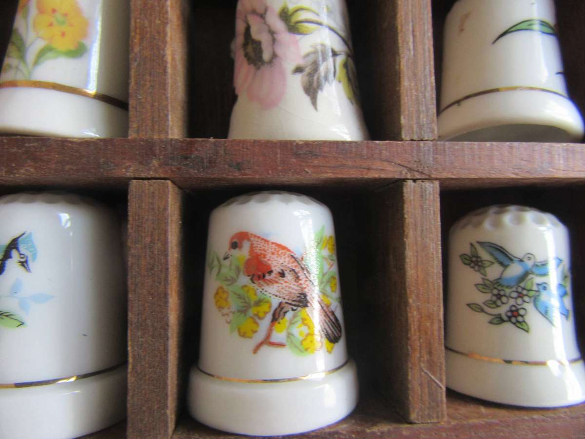20 BEAUTIFUL PORCELAIN THIMBLESIN SHELF - AS PER SCAN - BID PER ITEM