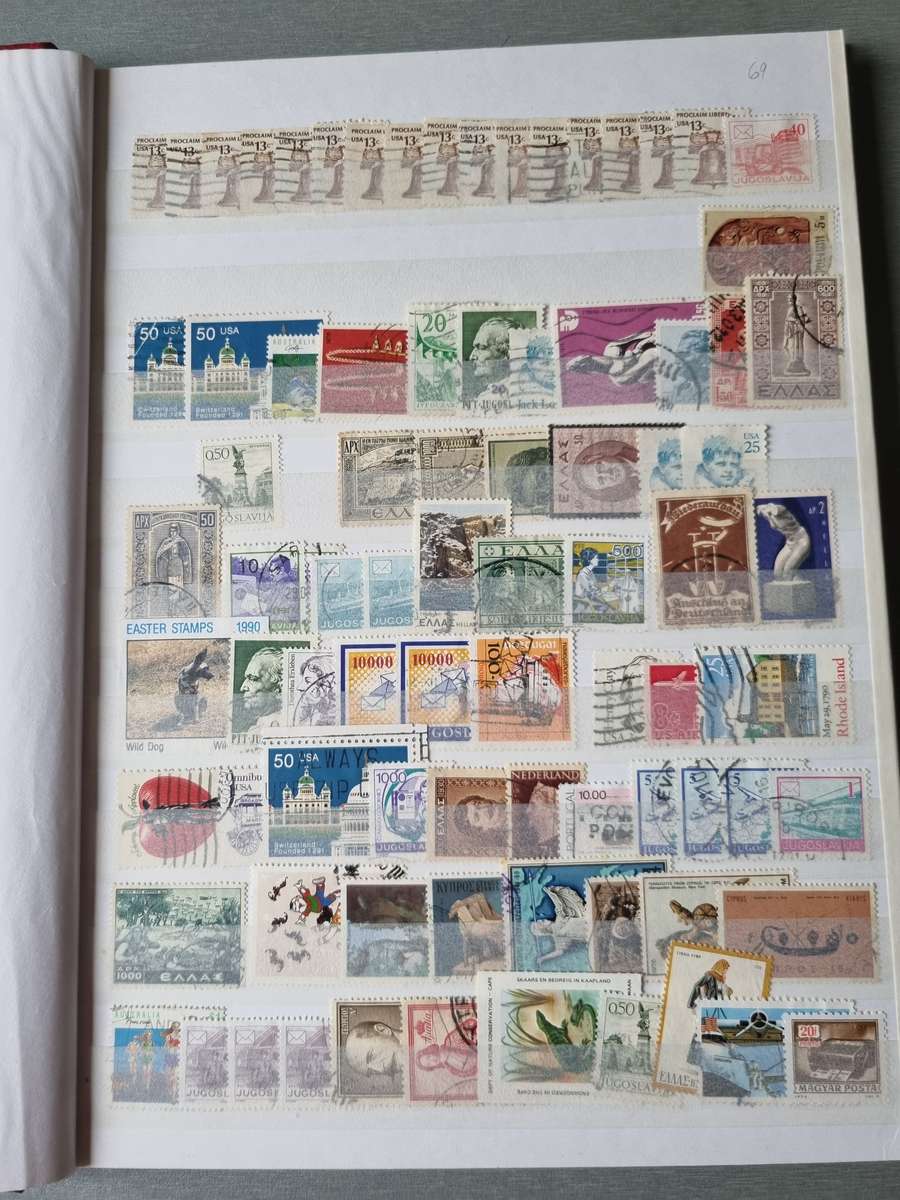 RED ALBUM 2ND HAND WITH MIXED WORLD STAMPS (MOSTLY USED). AS PER IMAGES. NB: PLEASE READ BELOW!!