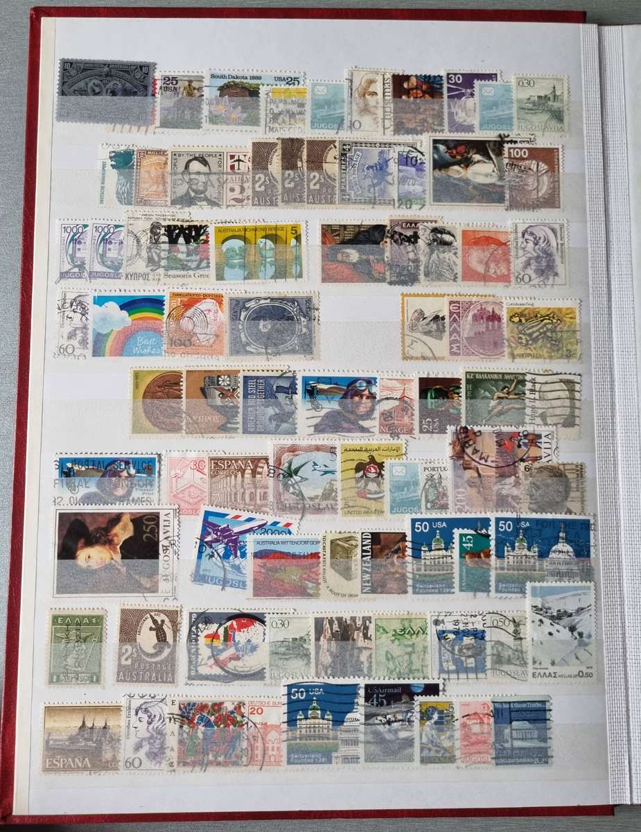 RED ALBUM 2ND HAND WITH MIXED WORLD STAMPS (MOSTLY USED). AS PER IMAGES. NB: PLEASE READ BELOW!!