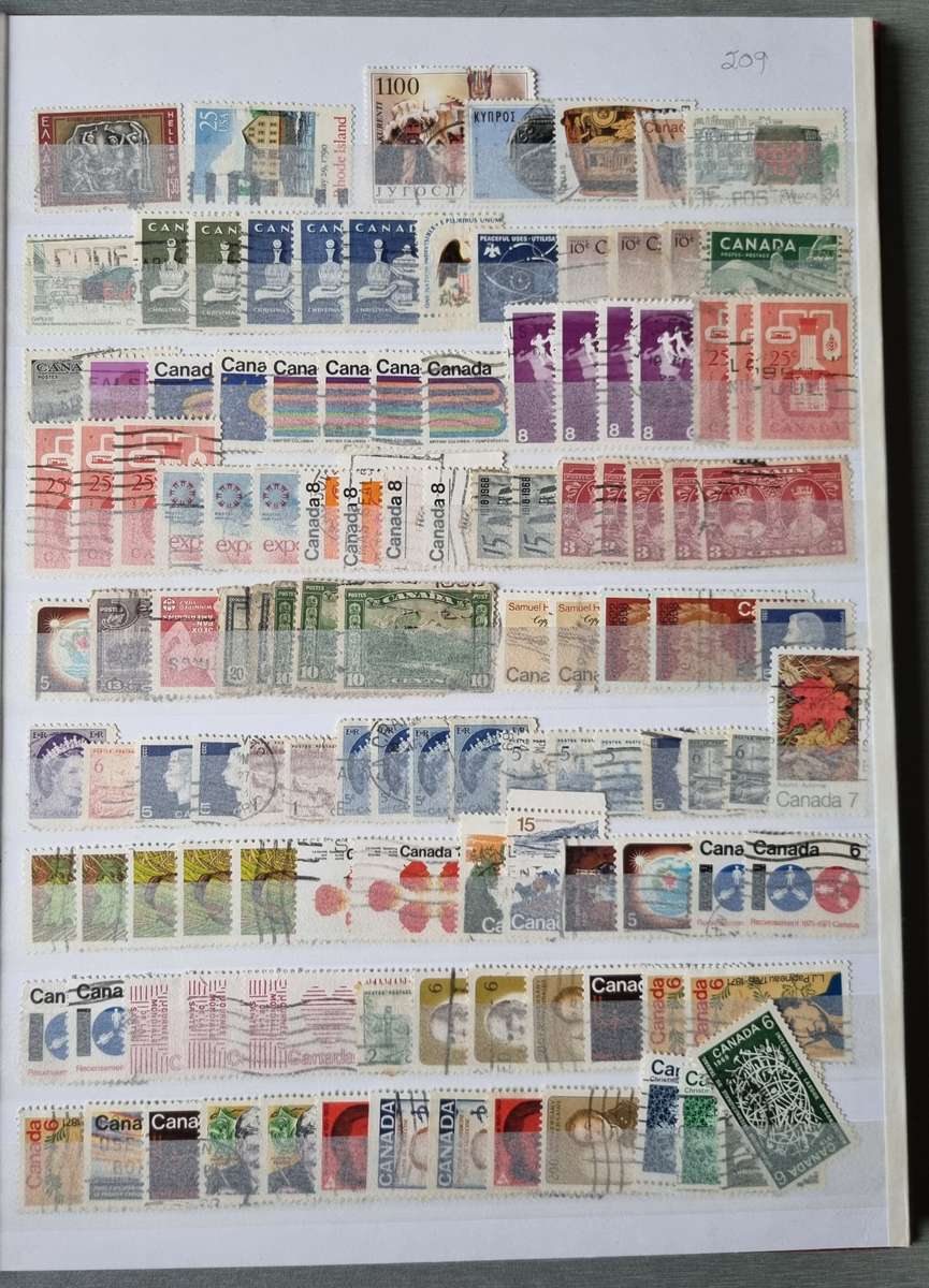 RED ALBUM 2ND HAND WITH MIXED WORLD STAMPS (MOSTLY USED). AS PER IMAGES. NB: PLEASE READ BELOW!!