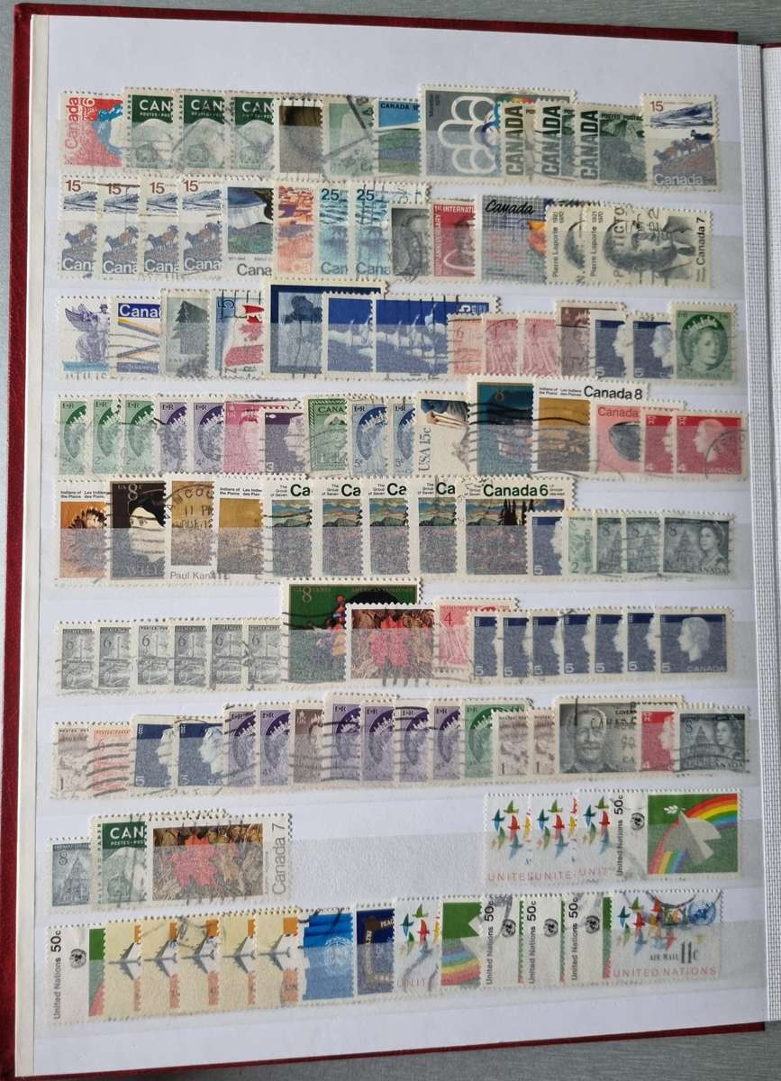 RED ALBUM 2ND HAND WITH MIXED WORLD STAMPS (MOSTLY USED). AS PER IMAGES. NB: PLEASE READ BELOW!!