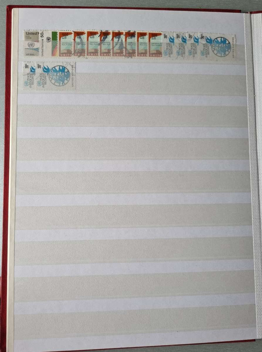 RED ALBUM 2ND HAND WITH MIXED WORLD STAMPS (MOSTLY USED). AS PER IMAGES. NB: PLEASE READ BELOW!!