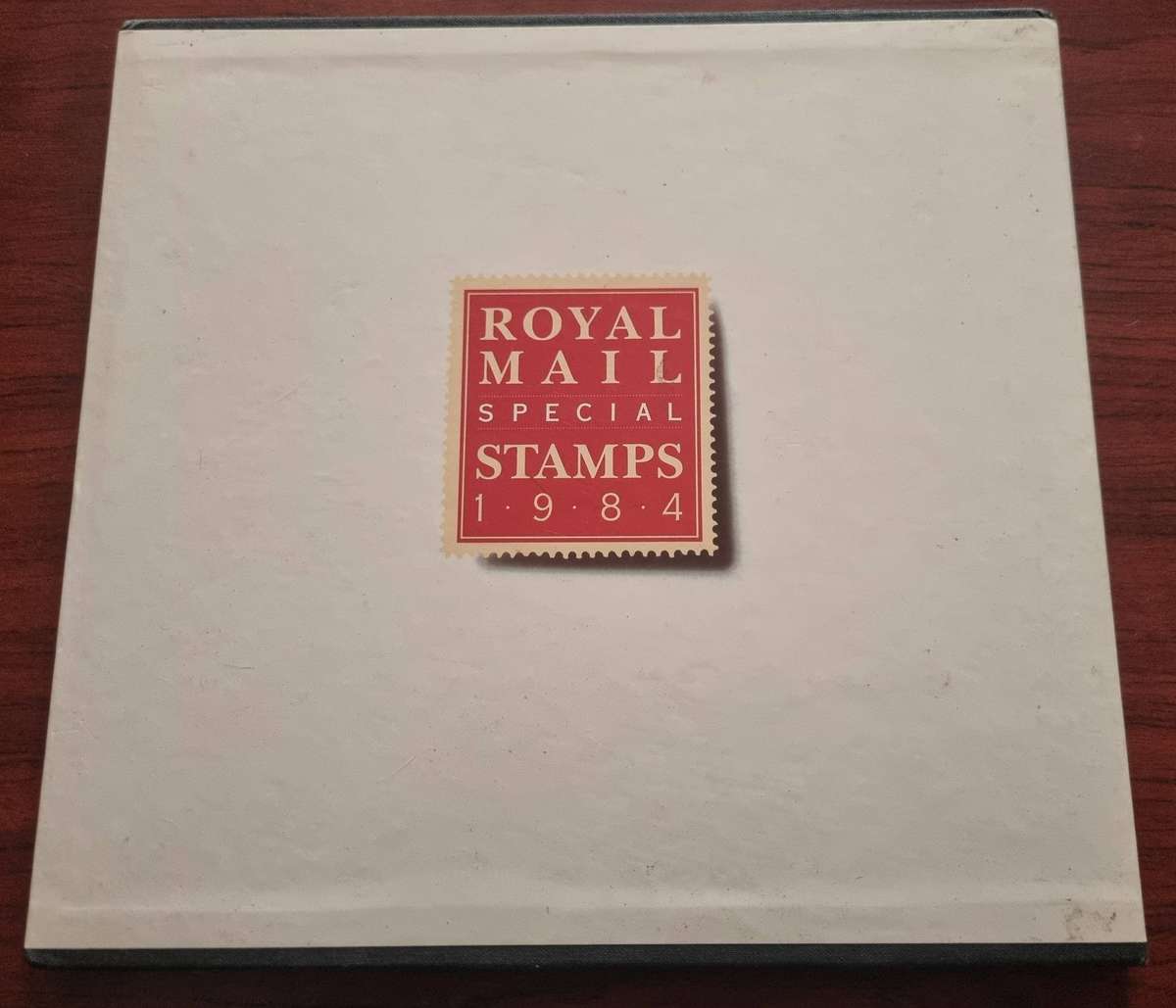 GB 1984 post office yearbook in 24 page hardbound book with slip case. SG1236/71 CV GBP 85.