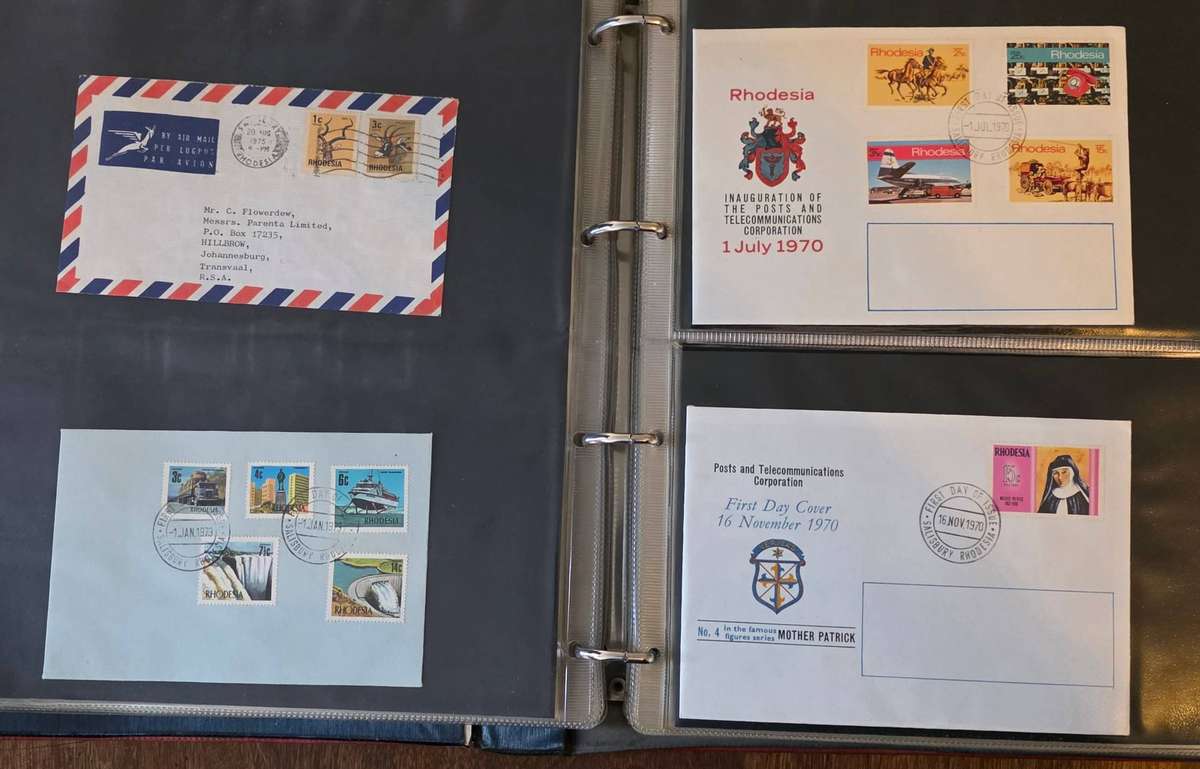 Red ring album with Rhodesia first day covers etc - condition as per images. Read.