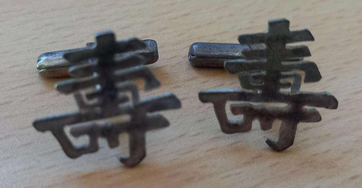 Silver cufflinks with Chinese symbol