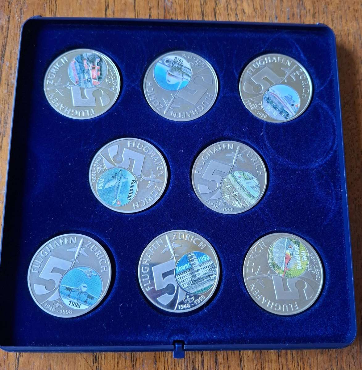 Set of 8 medallions commemorating 50 years of Zurich airport