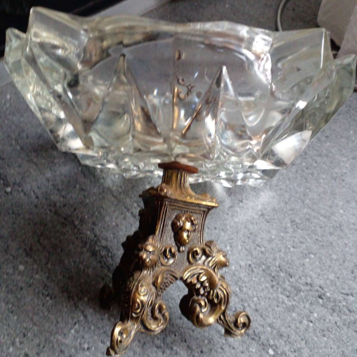 Vintage heavy crystal glass ashtray with an ornate brass stand.
