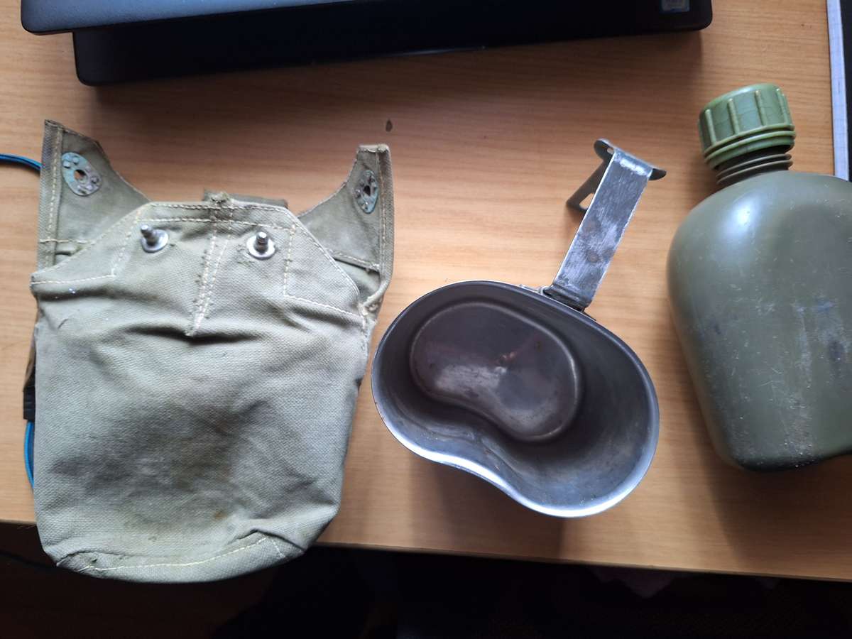 Army water bottle in pouch with bucket
