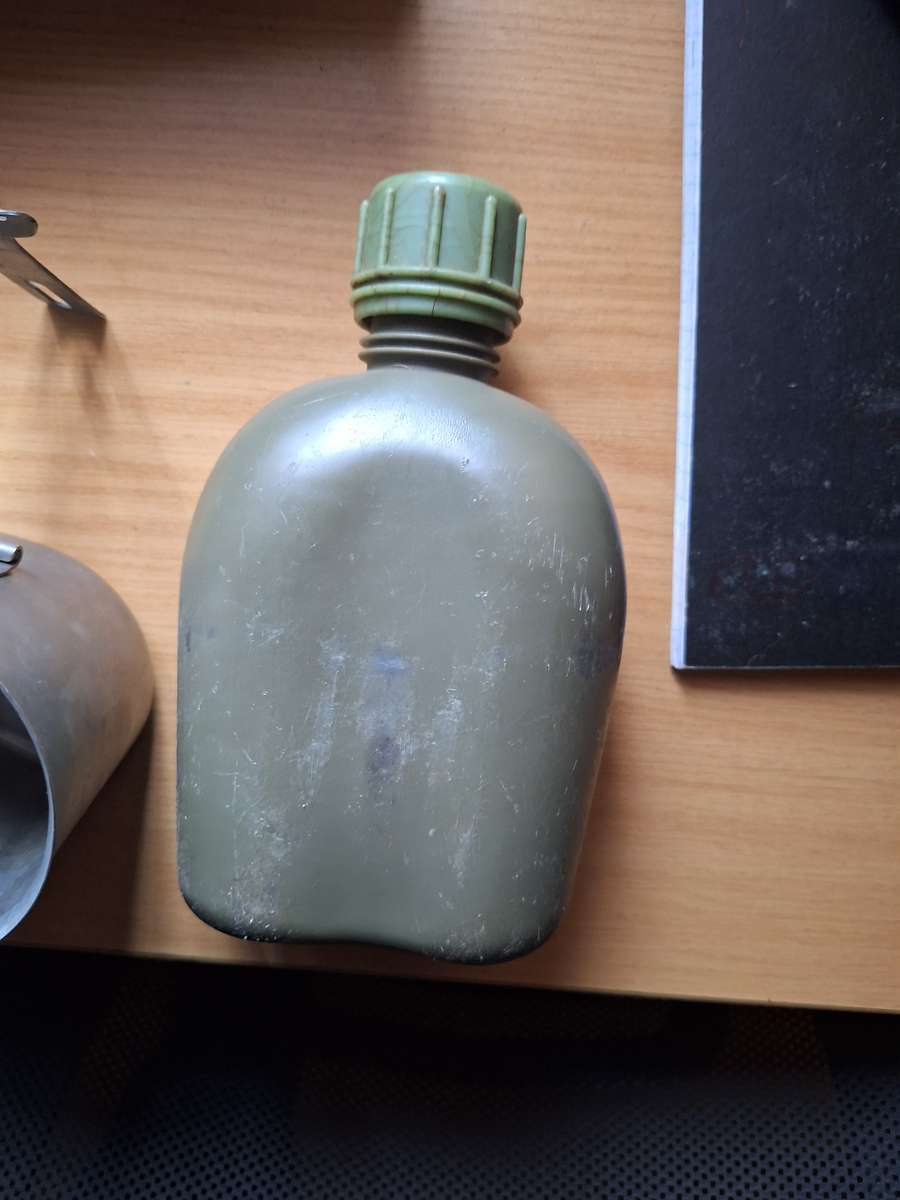 Army water bottle in pouch with bucket