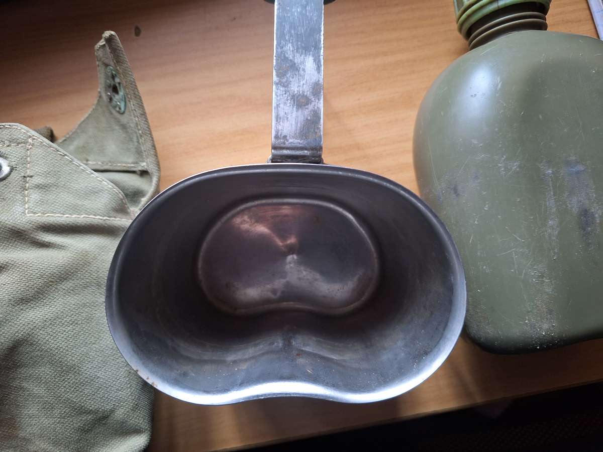 Army water bottle in pouch with bucket