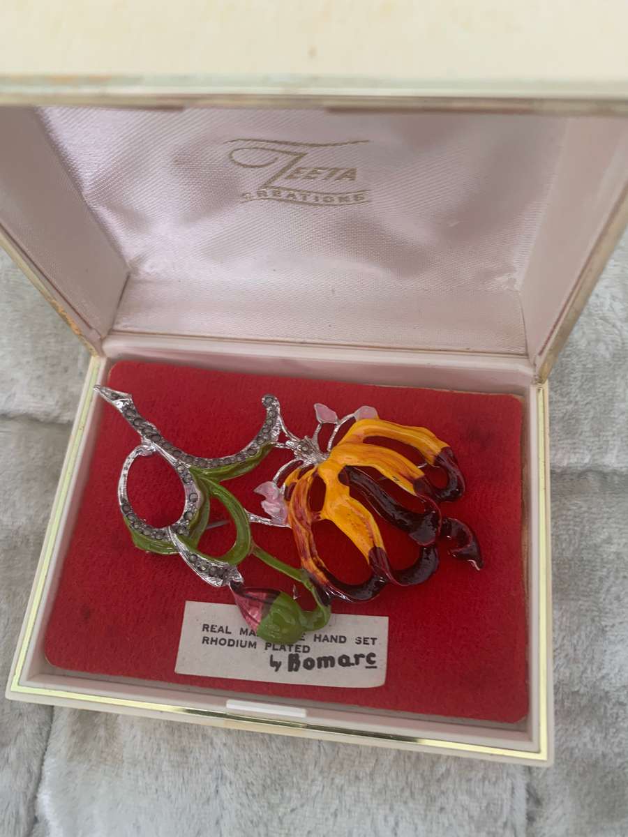 Flame lily brooch in box