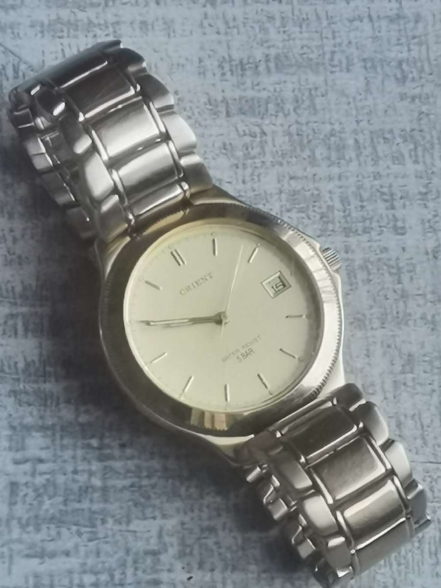 VINTAGE MENS ORIENT GOLD PLATED QUARTZ WATCH IN EXCELLENT WORKING CONDITION