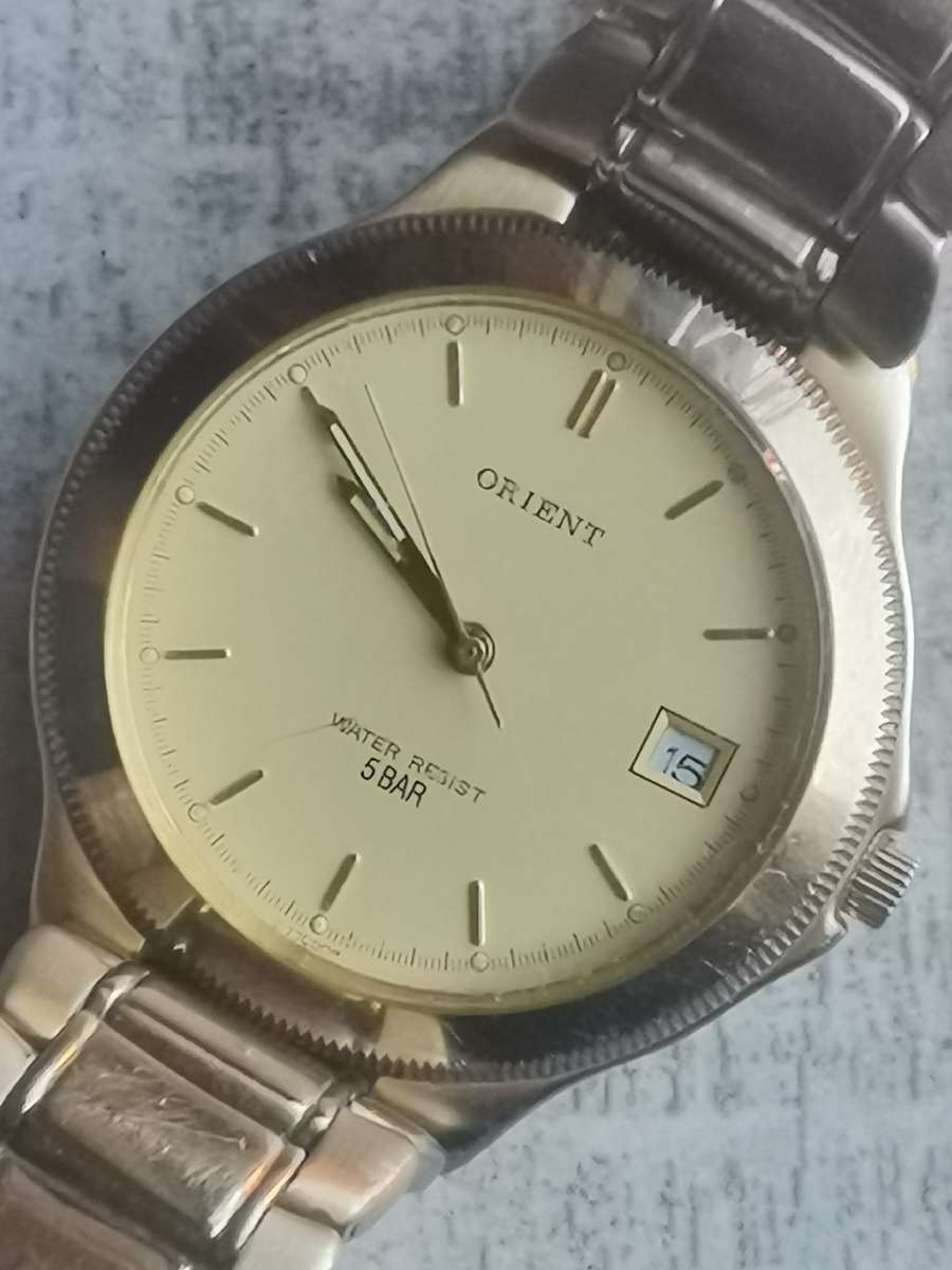 VINTAGE MENS ORIENT GOLD PLATED QUARTZ WATCH IN EXCELLENT WORKING CONDITION
