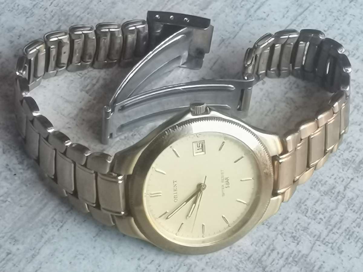 VINTAGE MENS ORIENT GOLD PLATED QUARTZ WATCH IN EXCELLENT WORKING CONDITION