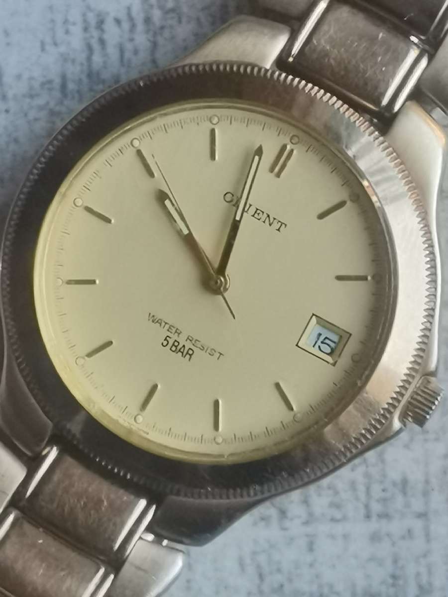 VINTAGE MENS ORIENT GOLD PLATED QUARTZ WATCH IN EXCELLENT WORKING CONDITION