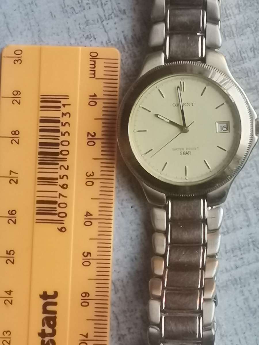 VINTAGE MENS ORIENT GOLD PLATED QUARTZ WATCH IN EXCELLENT WORKING CONDITION