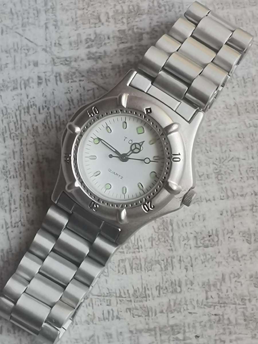 LADIES TORQ STAINLESS STEEL WATCH WITH ROTATING BEZEL IN EXCELLENT WORKING CONDITION
