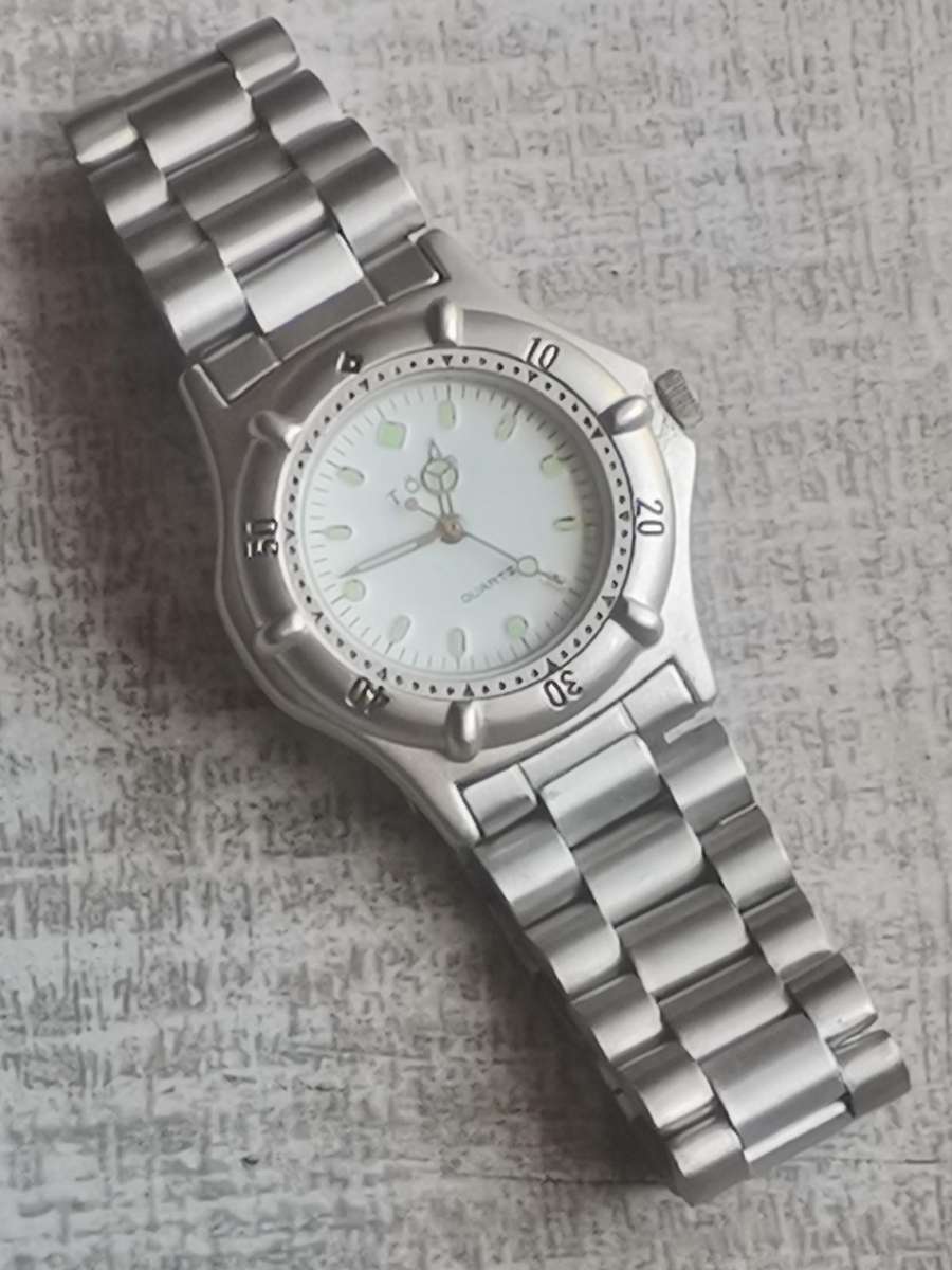 LADIES TORQ STAINLESS STEEL WATCH WITH ROTATING BEZEL IN EXCELLENT WORKING CONDITION
