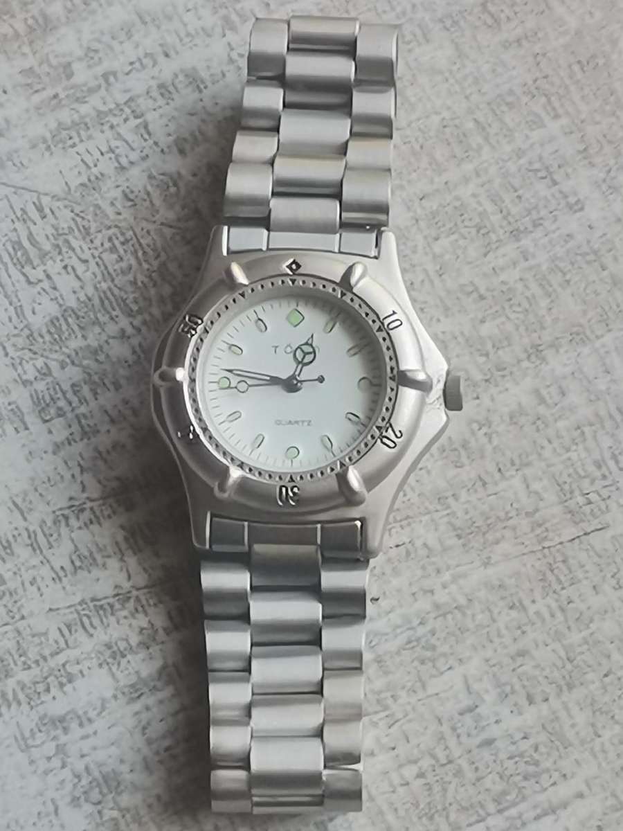 LADIES TORQ STAINLESS STEEL WATCH WITH ROTATING BEZEL IN EXCELLENT WORKING CONDITION