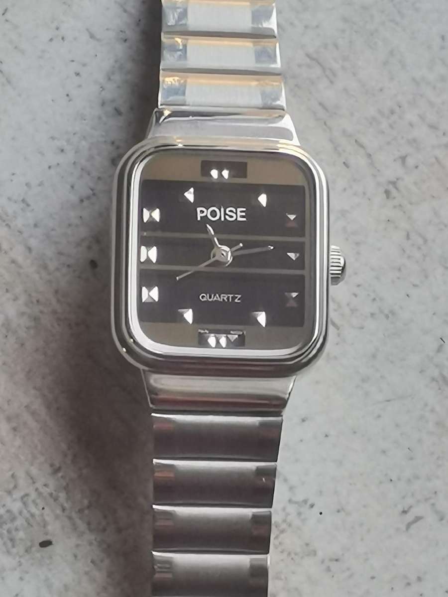 LADIES POISE STAINLESS STEEL WATCH IN EXCELLENT WORKING CONDITION