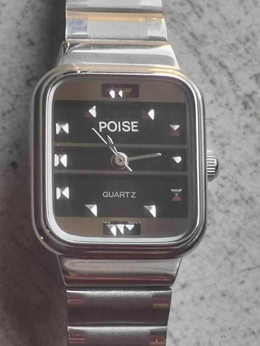 LADIES POISE STAINLESS STEEL WATCH IN EXCELLENT WORKING CONDITION