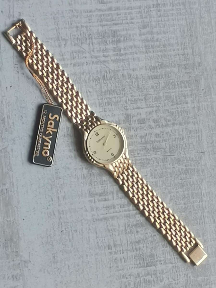 MENS VINTAGE SAKYNO ALL GOLD PLATED WATCH IN EXCELLENT WORKING CONDITION - NEW OLD STOCK