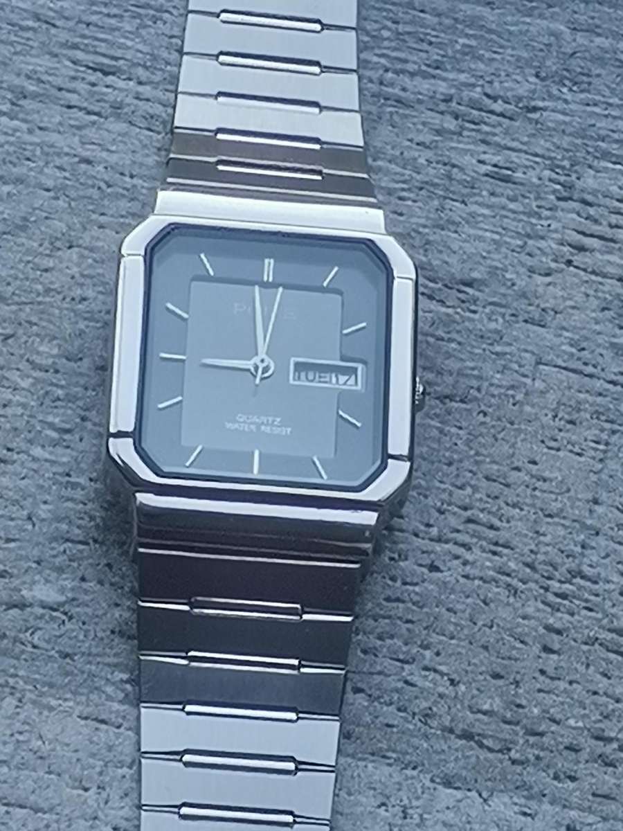 LADIES POISE STAINLESS STEEL WATCH WITH DAY/DATE FUNCTION IN EXCELLENT WORKING CONDITION