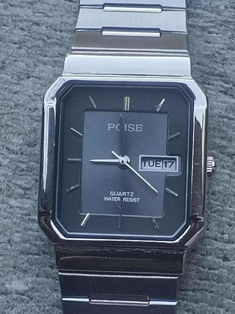 LADIES POISE STAINLESS STEEL WATCH WITH DAY/DATE FUNCTION IN EXCELLENT WORKING CONDITION
