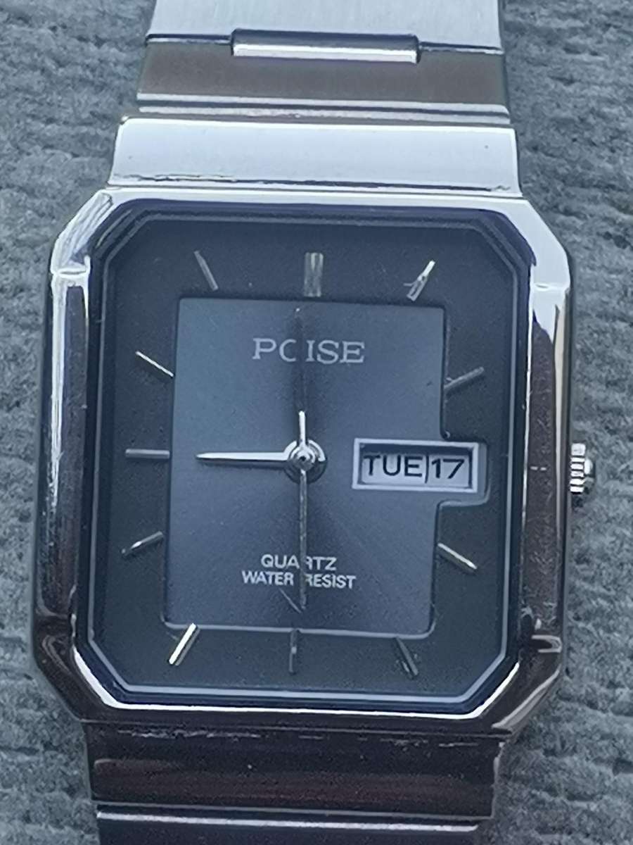 LADIES POISE STAINLESS STEEL WATCH WITH DAY/DATE FUNCTION IN EXCELLENT WORKING CONDITION