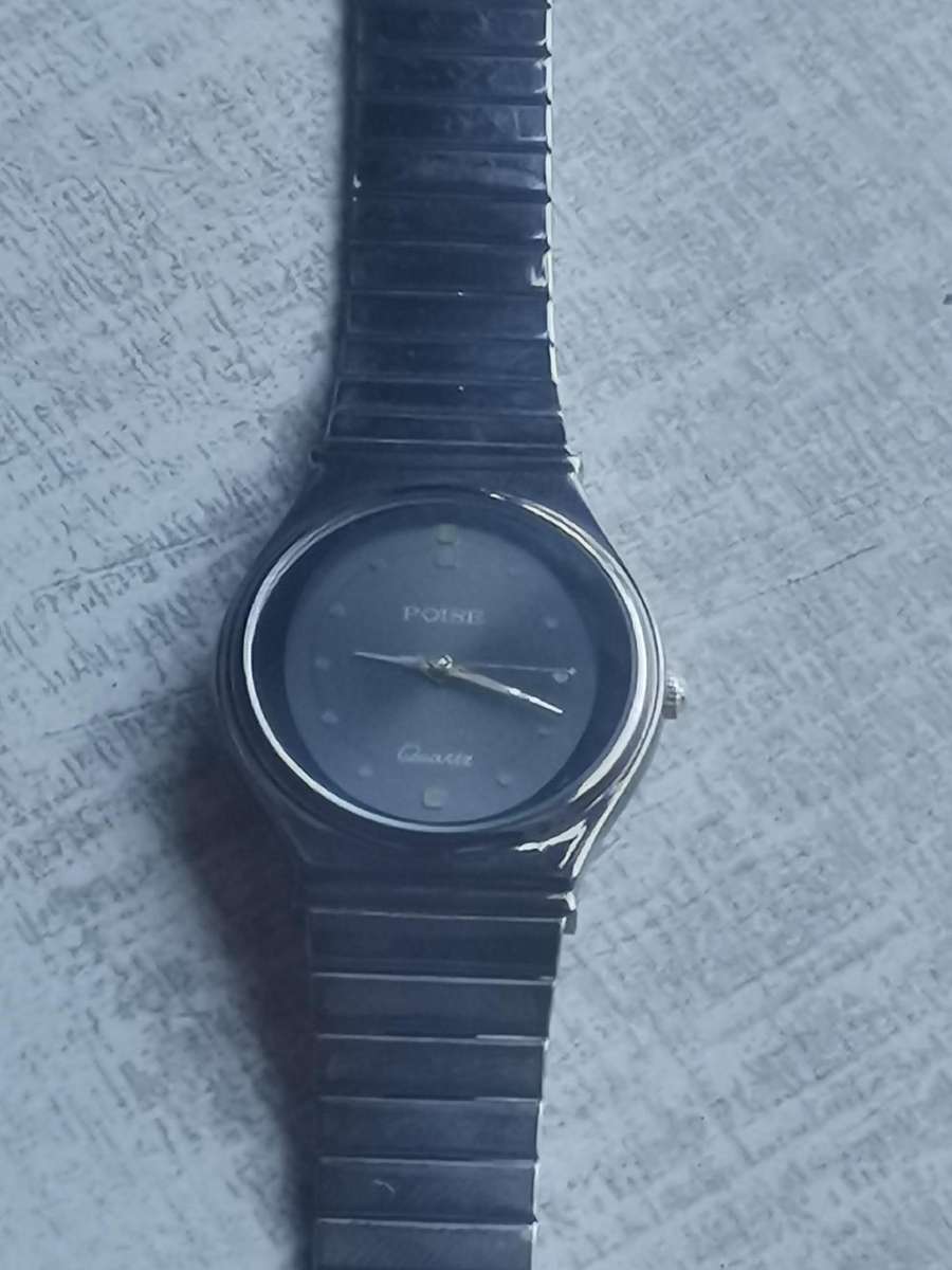 LADIES POISE ALL BLACK STAINLESS STEEL WATCH IN EXCELLENT WORKING CONDITION