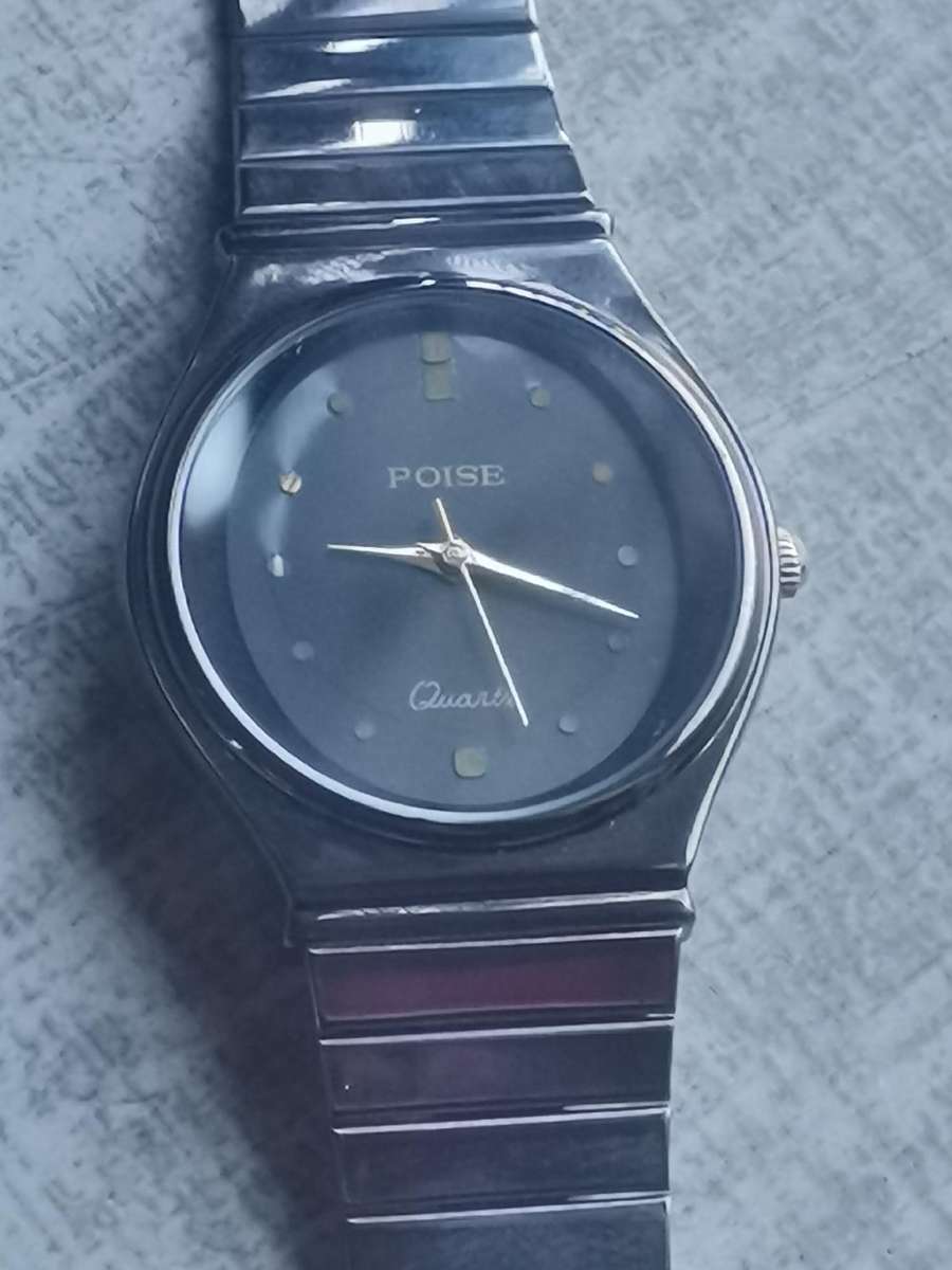 LADIES POISE ALL BLACK STAINLESS STEEL WATCH IN EXCELLENT WORKING CONDITION