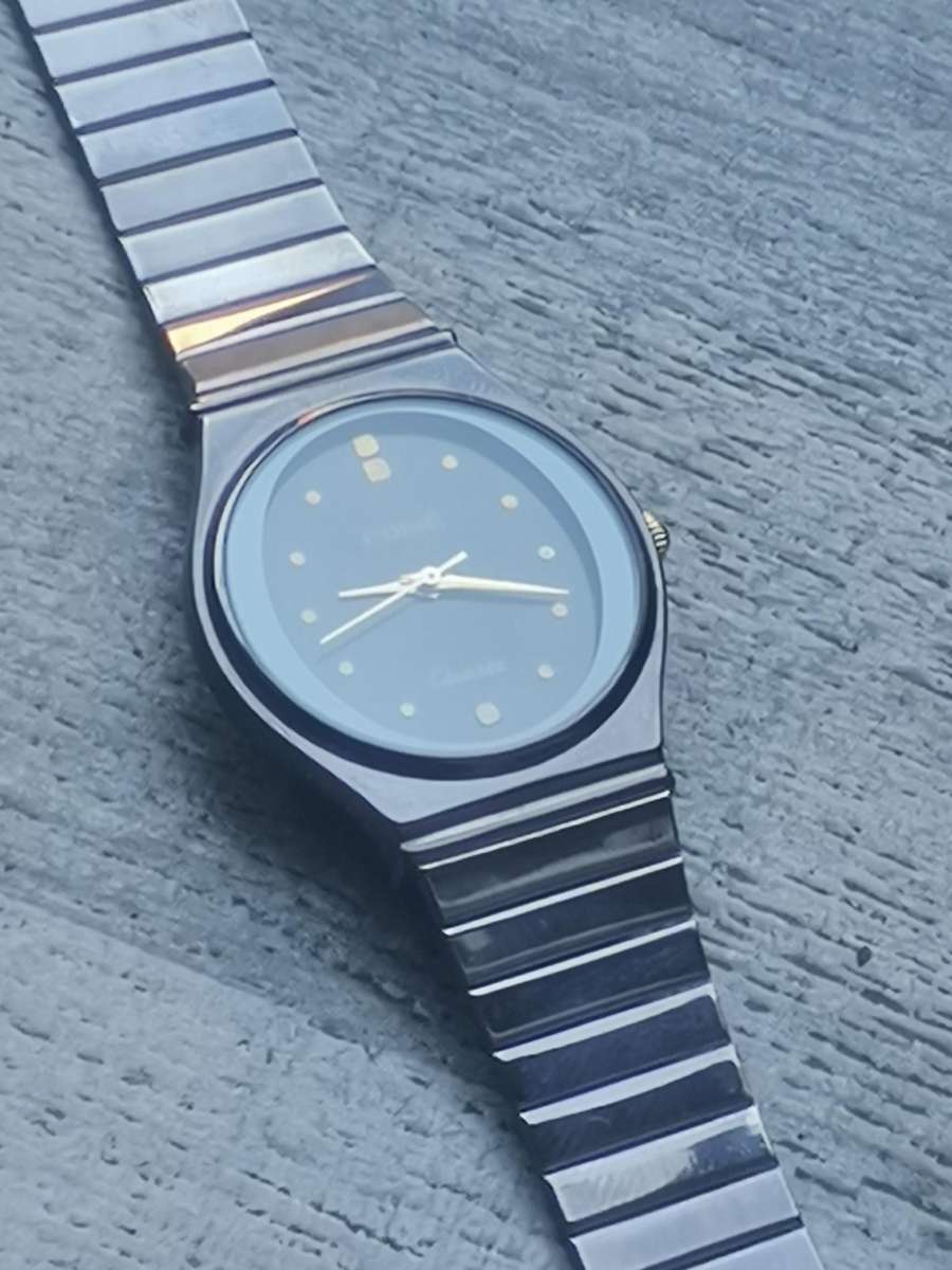 LADIES POISE ALL BLACK STAINLESS STEEL WATCH IN EXCELLENT WORKING CONDITION