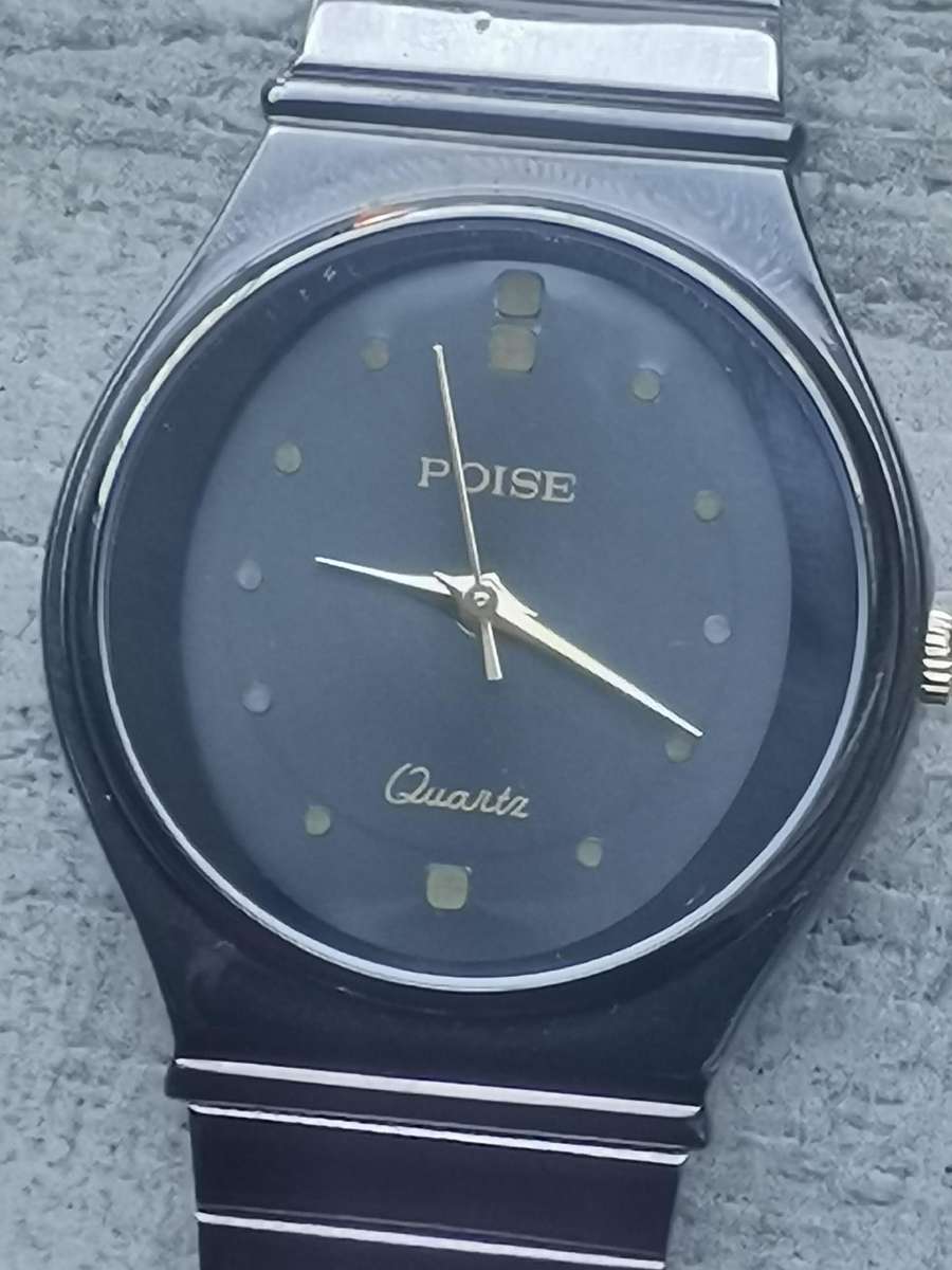 LADIES POISE ALL BLACK STAINLESS STEEL WATCH IN EXCELLENT WORKING CONDITION