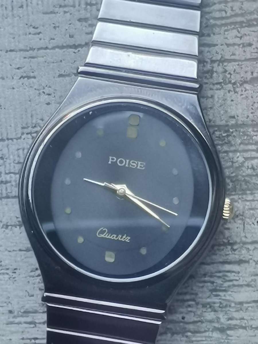 LADIES POISE ALL BLACK STAINLESS STEEL WATCH IN EXCELLENT WORKING CONDITION