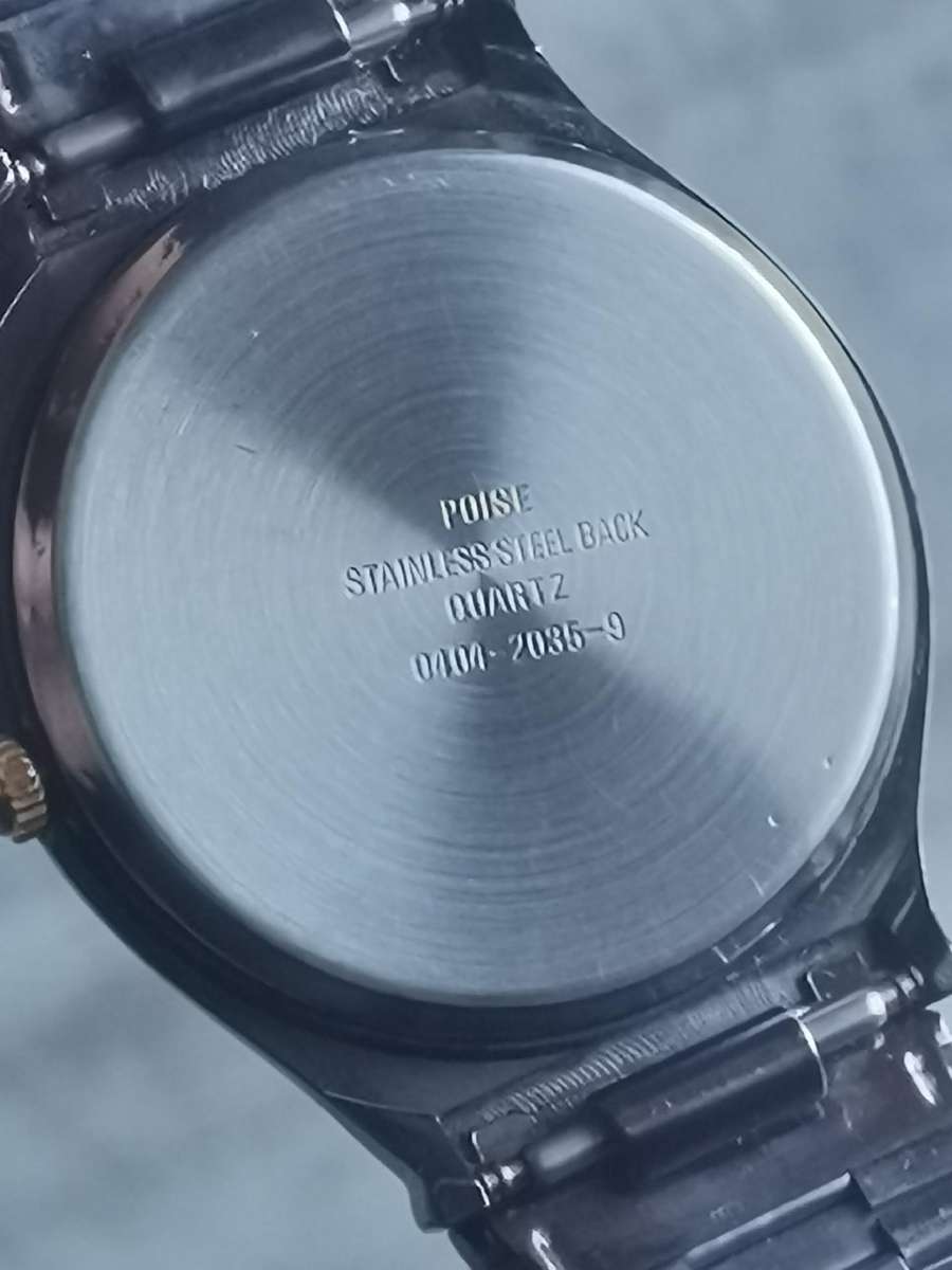 LADIES POISE ALL BLACK STAINLESS STEEL WATCH IN EXCELLENT WORKING CONDITION